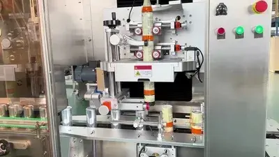 Aplicador de mangas termoencogibles para latas de aluminio