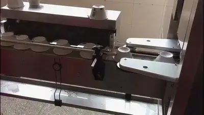 Aplicador de mangas termoencogibles para vasos y recipientes